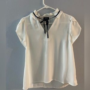 White blouse with black accent